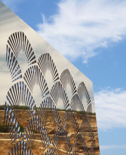 Reflections on a gold mirror panel in a Mykonos villa